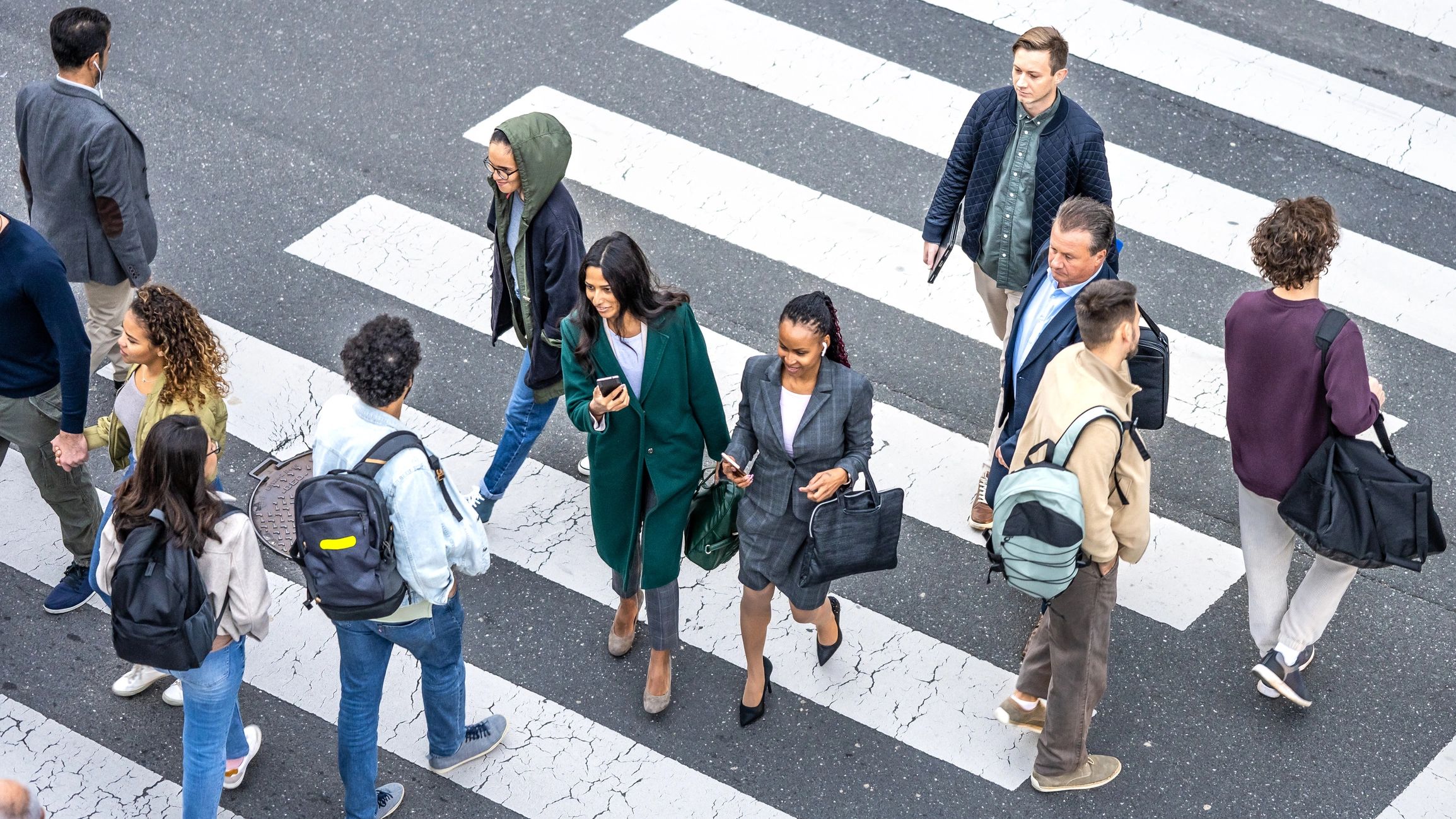 Top view of pedestrians crossing a zebra crossing