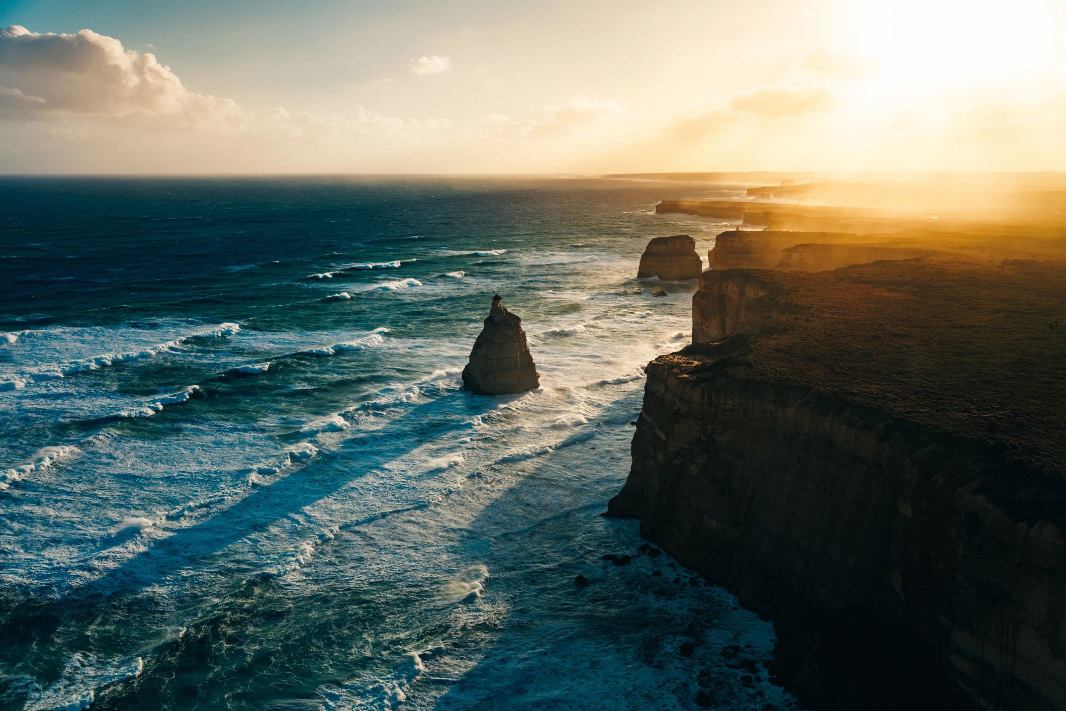 Aerial view of coastal rock formations at sunset